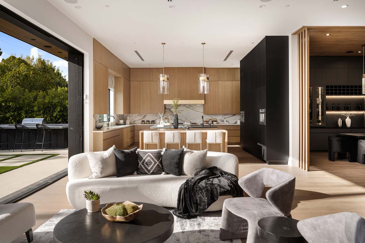 Open-plan living space featuring a seamless flow between kitchen, dining, and lounge areas, highlighting modern design for flexible living 