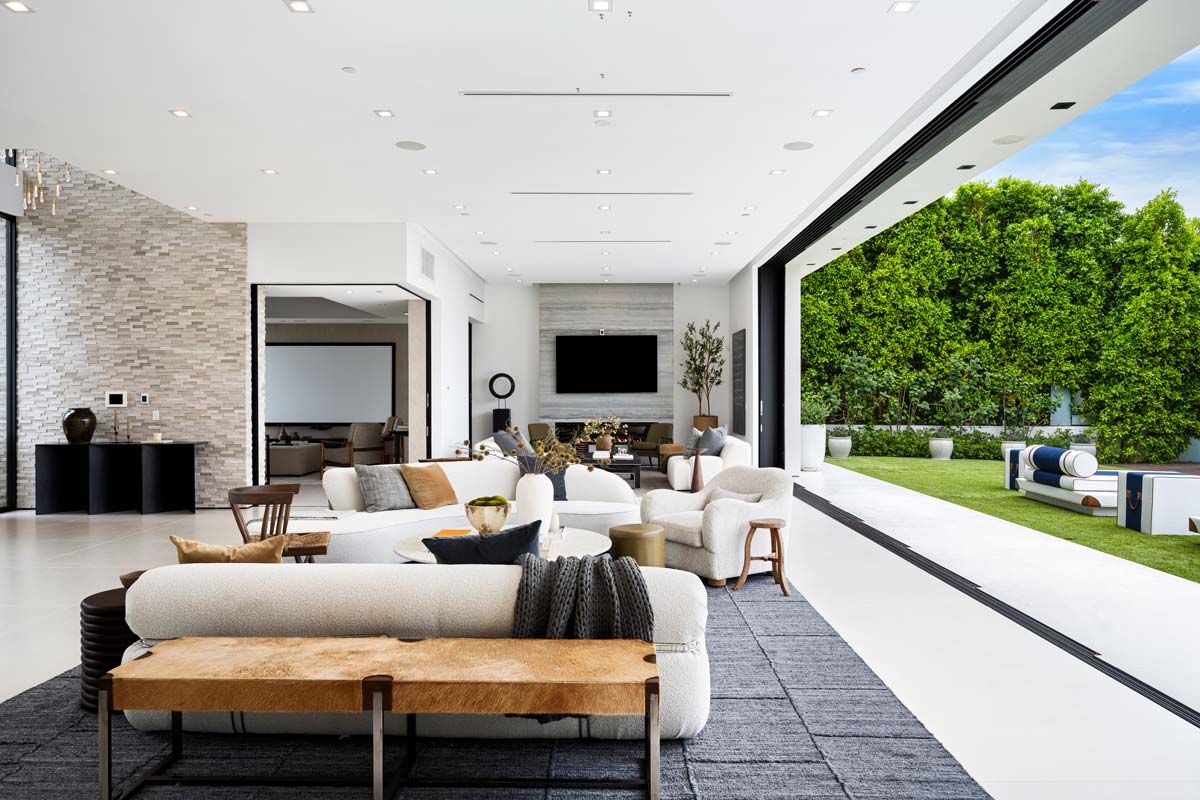 Seamless Transition Between Indoor And Outdoor Living Spaces Through Large Glass Doors