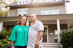 Happy Melbourne Homeowner Standing In Front Of Their Completed Renovation Project